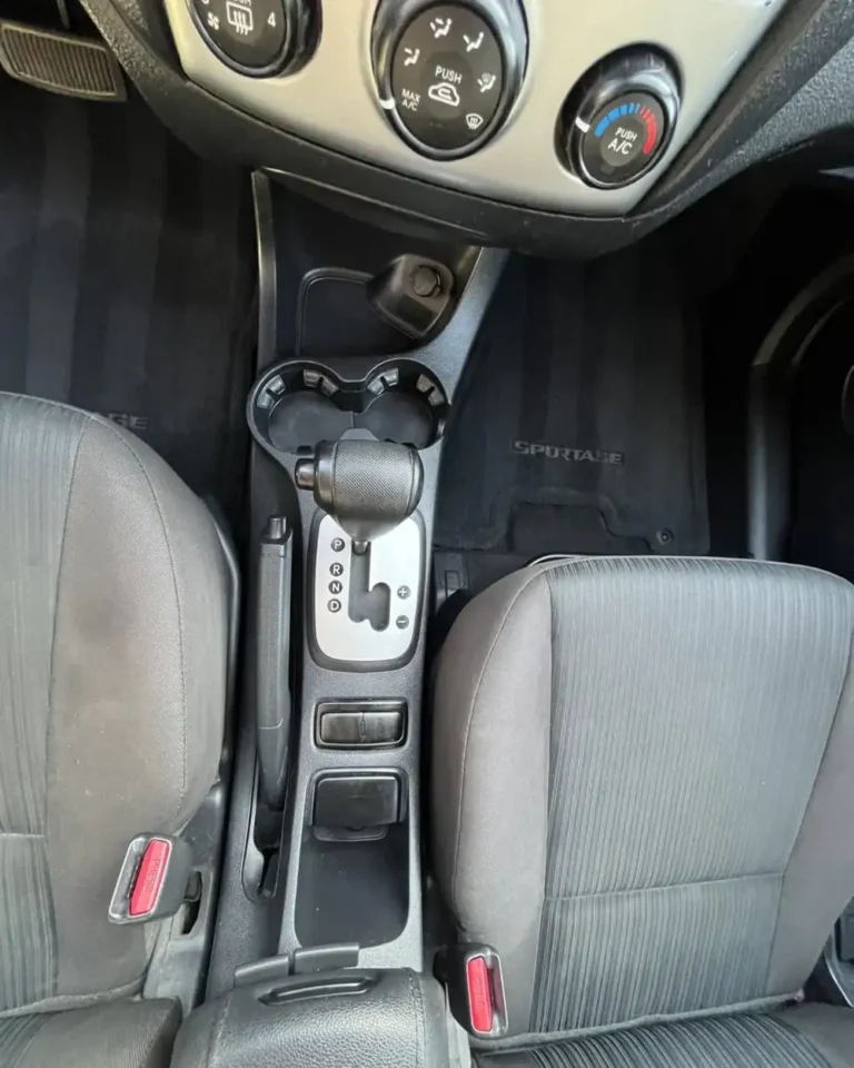 Clean center console, shifter, and cup holders after interior detail