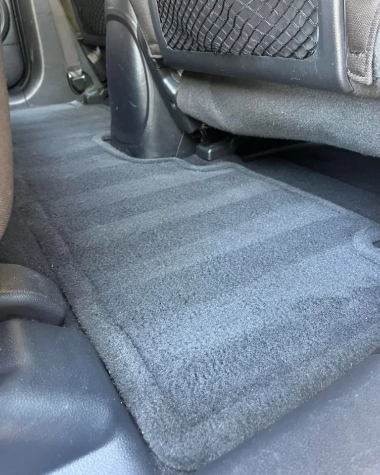Clean rear floor carpet after interior detailing and shampoo