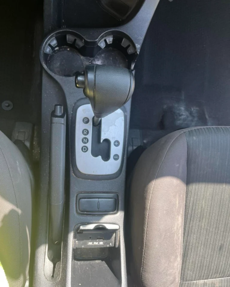 Dusty center console and gear shifter before interior detail