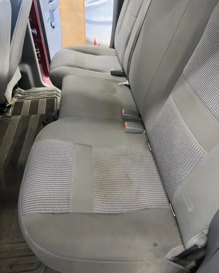 Stained cloth rear bench seats before car seat shampoo